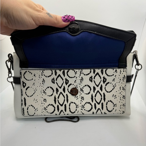 Reed Crossbody Purse Clutch featuring a removable metal chain strap Animal Print - Picture 9 of 9